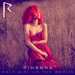 A photo of Rihanna covering her body with a piece of red fabric in a field.