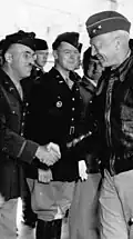 Oscar W. Koch receives congratulations from I Armored Corps commander George Patton in May 1942.