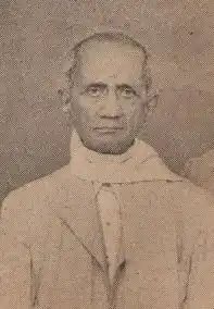 A sepia-toned photograph of an old man