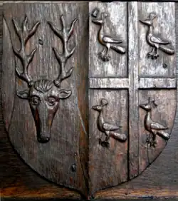 Parker impaling Argent, a cross gules between three peacocks azure (Smith of Little Baddow), oak screen, North Molton