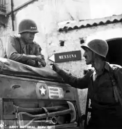 Patton with Lt. Col. Lyle Bernard in Brolo, Sicily, in August 1943.