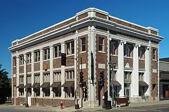 Two-story brick building with engaged columns on a corner lot