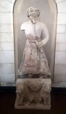 Male figure with a sword, often presumed to be the caliph