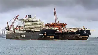 Carrying a 5,500 t (6,100-short-ton) test platform in the bow slot (Aug 2016)[25]