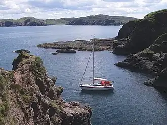 Yacht moored in Port na h-Uaille, Eilean nan Ròn