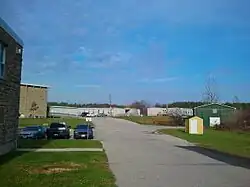 Two externally dilapidated portables are present at the school.