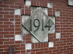 Tile on the tunnel's west portal marks year of opening
