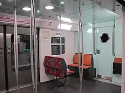 MI 09 interior, boarding area (mid-deck) with space for wheelchairs and seats for passengers who can not use stairs