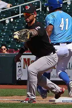 A baseball player in black and gray