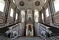 Sweeping marble staircase inside the Palace of Caserta