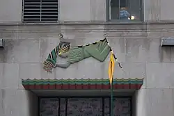 Lintel depicting a woman above the entrance at 10 West 51st Street