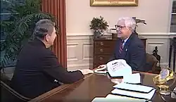 Video still of President Ronald Reagan in the Oval Office conversing with Jack Reed