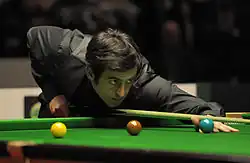 Ronnie O'Sullivan playing a shot