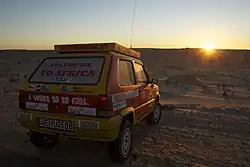 A Fiat Panda 4×4 is awaiting the morning start at one of the Mauritanian camps of the rally.