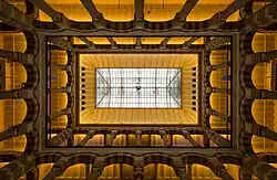 Interior view of Magna Plaza to the top with high ceiling and arcs, 2014.