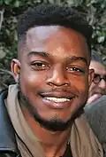 Stephan James posing for a photograph in 2017.