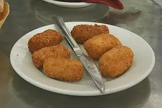 Croquetas, breaded and fried rolls typically filled with ham, chicken, or cod.