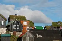 Image 13Traditional Faroese houses with turf roof in Reyni, Tórshavn. Most people build larger houses now and with other types of roofs, but the turf roof is still popular in some places. (from Culture of the Faroe Islands)