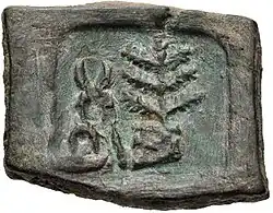 Taxila coin with hill and tree-in-railing (185–168 BCE)