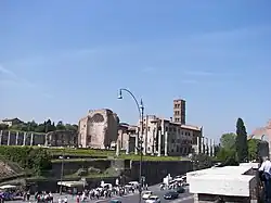 Olivetan monastery behind the apse and bell-tower with outer columns of the former Temple of Venus and Roma.