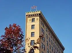 The illuminated red star on the apex of the Flat Iron Hotel, first raised for Christmas in 2024.