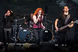 The Gentle Storm live at the 2015 Wacken Open Air. From left to right: Marcela Bovio, Ed Warby, Anneke van Giersbergen and Johan van Stratum