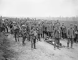 German prisoners guarded by British soldiers of the 58th Division at Sailly Laurette, 8 August 1918.