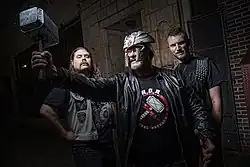 From left to right: John Liebel (guitar), Jon Mikl Thor (vocals), and Ted Andre Jedlicki (bass).