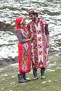 Tourists posing in traditional Kullu attire, at Solang valley