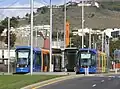 Two trams at the Gracia stop on Line 1