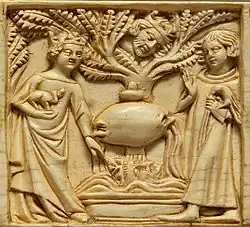 An ivory casket carving showing Tristan and Iseult next to a fountain (1340–50) (The Louvre)