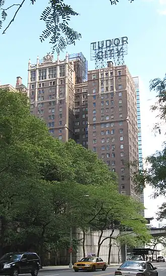 Prospect Tower in Tudor City, as seen from 42nd Street. The tower is topped by a large sign with the complex's name.