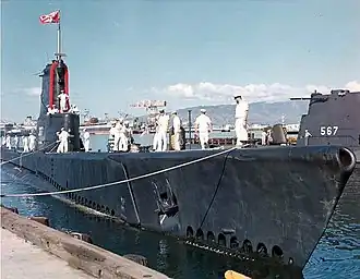 USS Carbonero (SS-337) about to tie up inboard of the Gudgeon (SS-567) at Pearl Harbor, c. 1963.