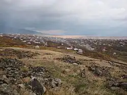 The village of Ushi. Smoke rises as villagers burn dead plant material during the fall season.