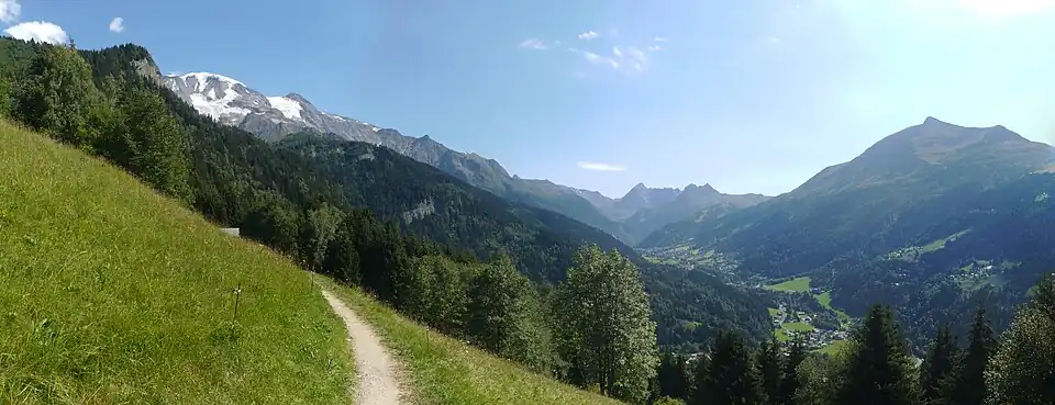 Summer view of the valley of Les Contamines; left: the snow-capped Dômes, facing Mont-Joly.