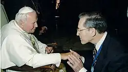Photo of William S. Sly meeting Pope John Paul II at the Vatican