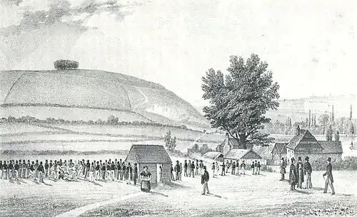 Illustration of Winchester football by Richard Baigent, 1838, showing lines of "kickers-in" on both sides of the pitch on Ridding Meads. St. Catherine's Hill, where the game was once played, is in the background.