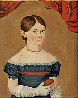 Young Girl in Blue Dress Holding an Egg